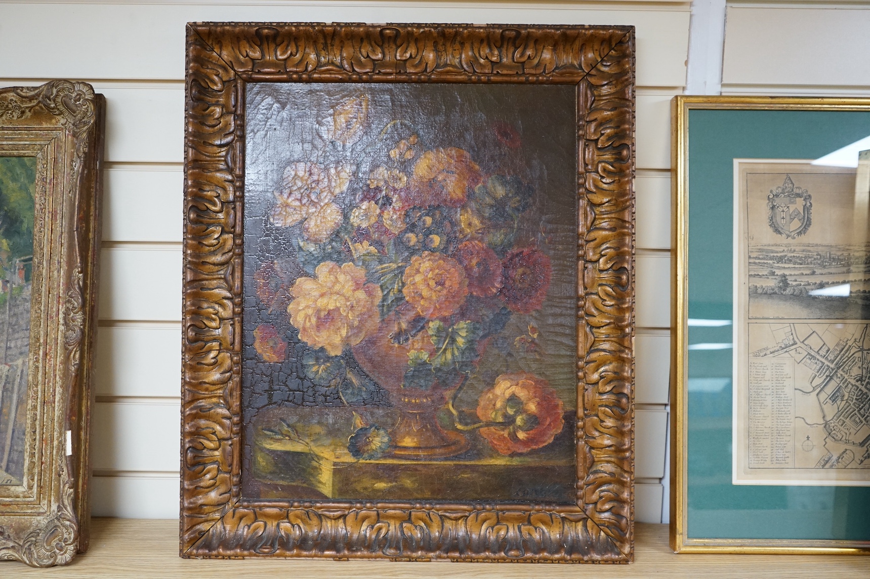 20th century School, oil on canvas, Still life of flowers in a vase, indistinctly signed and dated 1930, 49 x 39cm, ornate frame. Condition - craquelure throughout